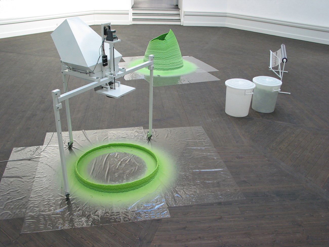 75P (Installationview), 2004, Dyed paraffin wax, iron, heating element and engine, Variable dimensions (machine 150 x 150 x 150 cm)